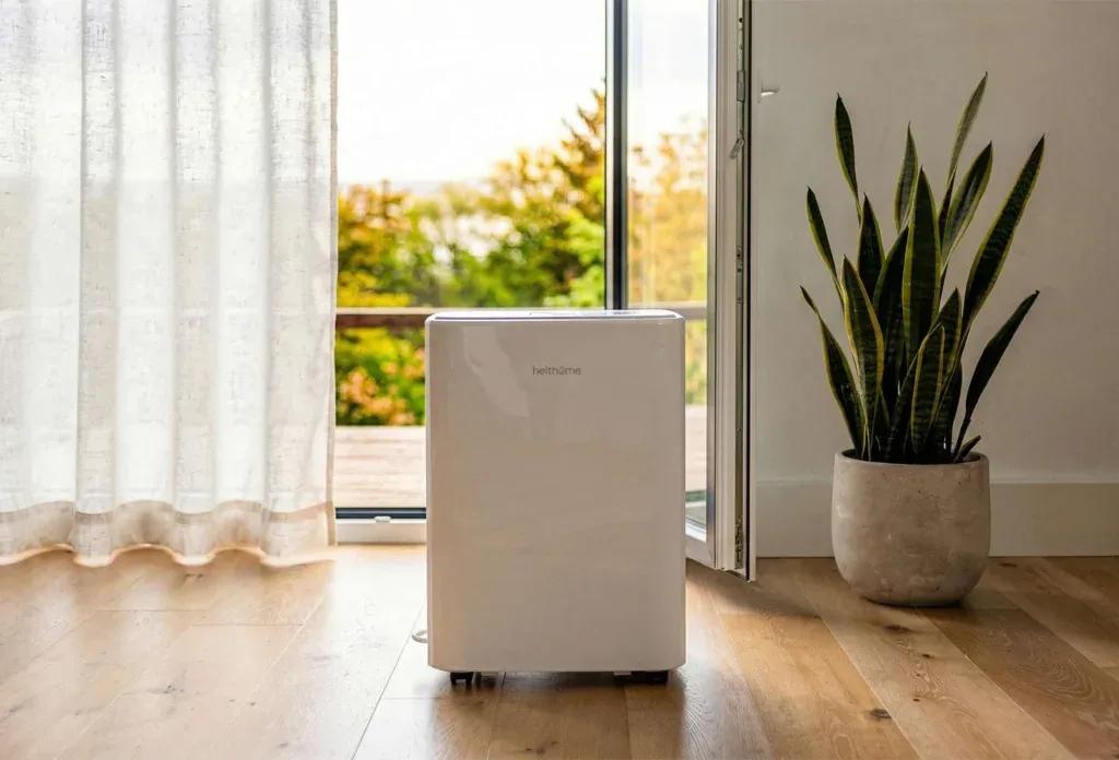 A helthome dehumidifier in a bright living room — an effective solution for managing indoor humidity and dampness