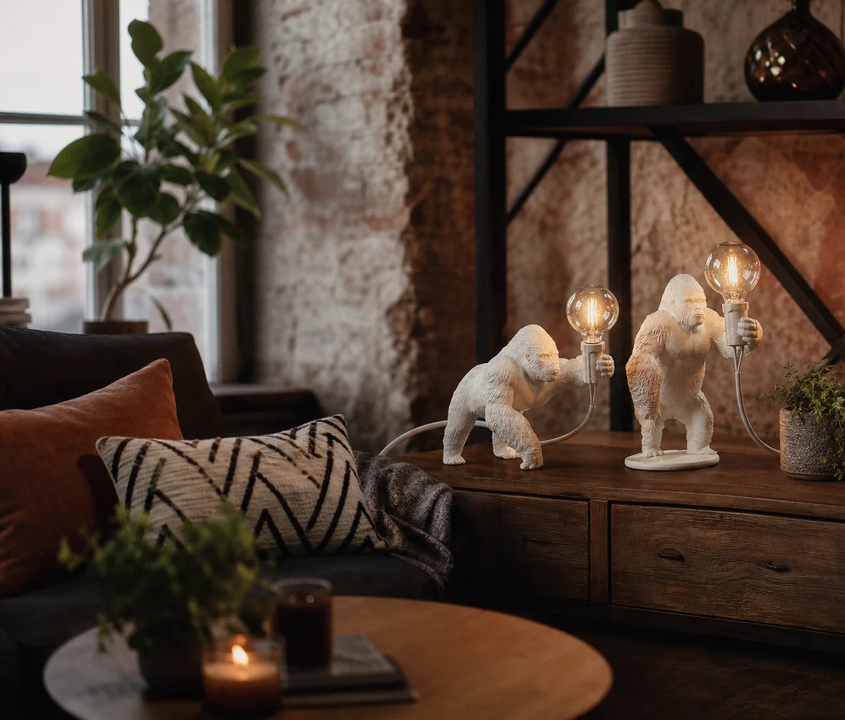White gorilla table lamps with Edison bulbs on rustic wooden sideboard in industrial living room
